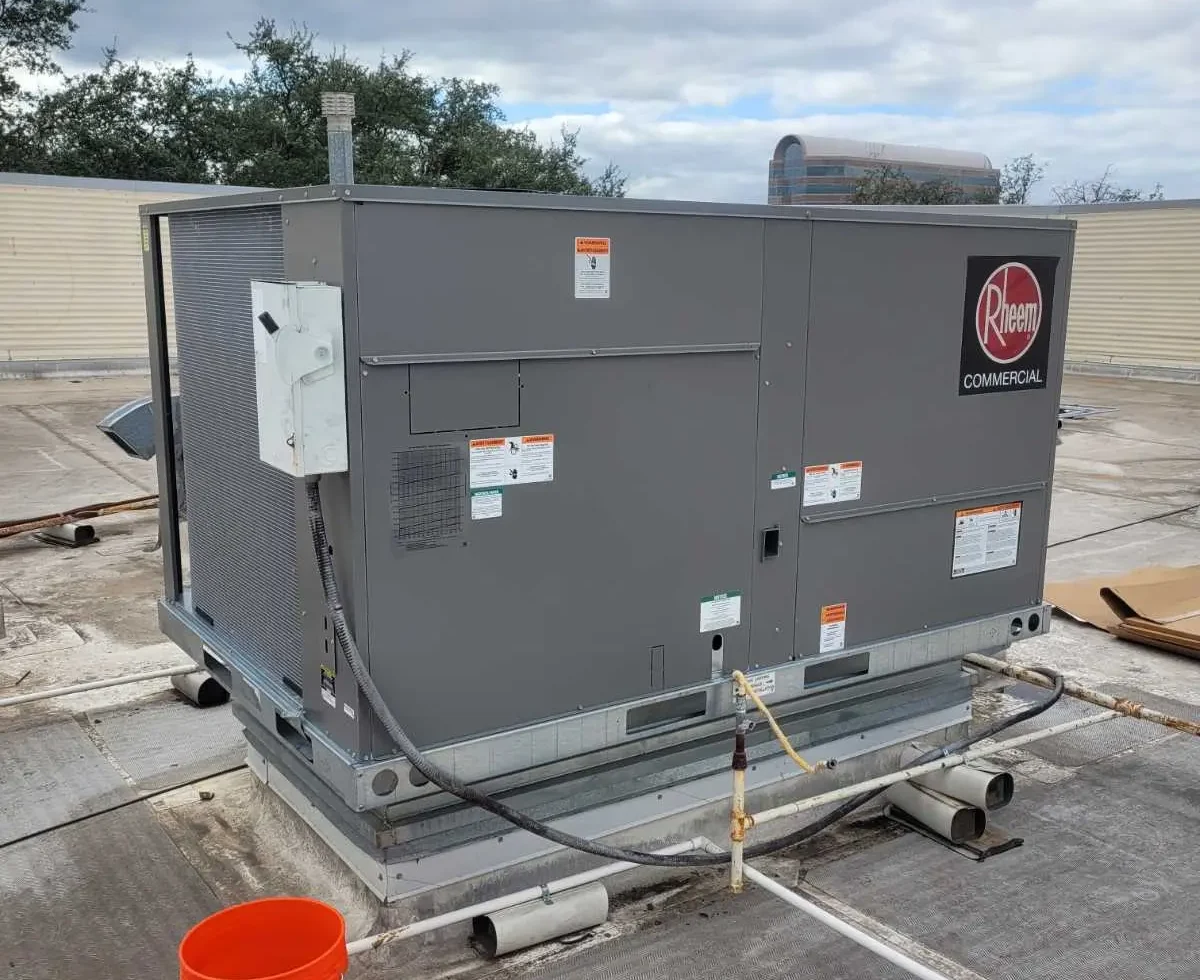 GenMech AC founder and team working on commercial HVAC equipment in Midland, TX