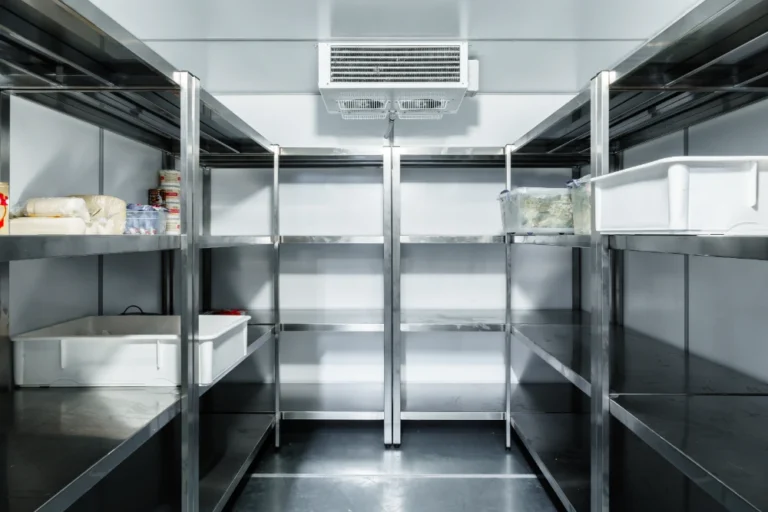 Interior of a commercial walk-in cooler with evaporator unit, illustrating refrigeration repair in Midland, TX.