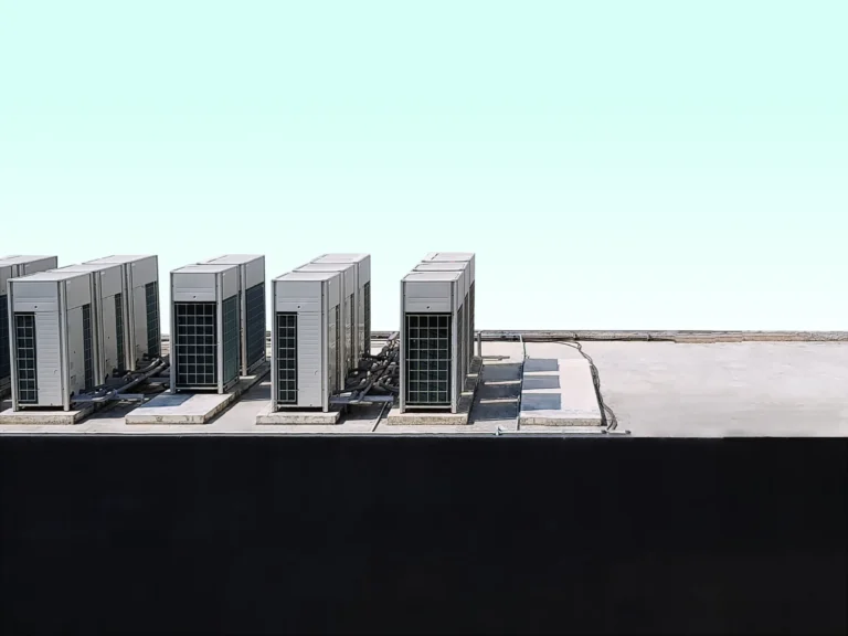 VRF outdoor condensing units installed on a commercial building rooftop with refrigerant line sets