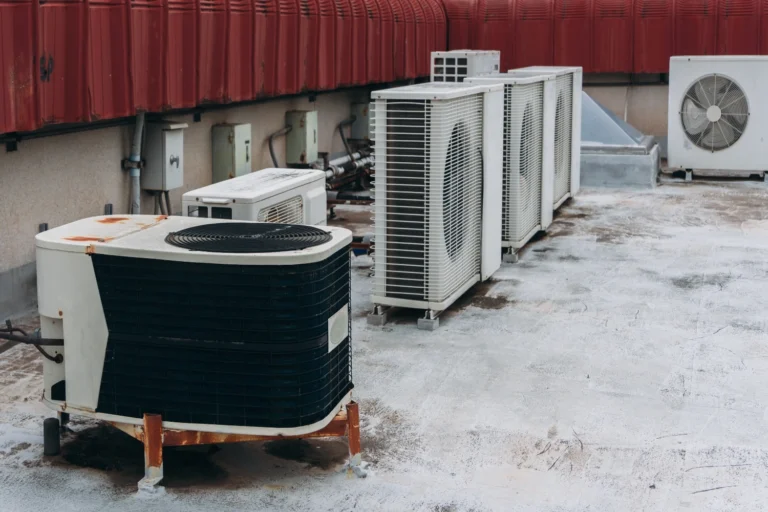 Split system and ductless condensers mounted on a commercial building rooftop