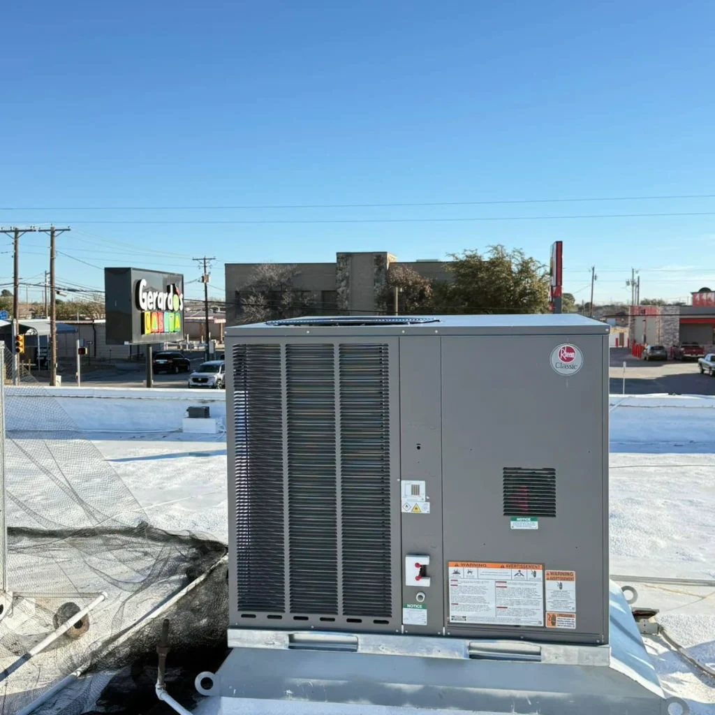 A new Rheem Classic packaged rooftop unit installed on a commercial building's flat roof